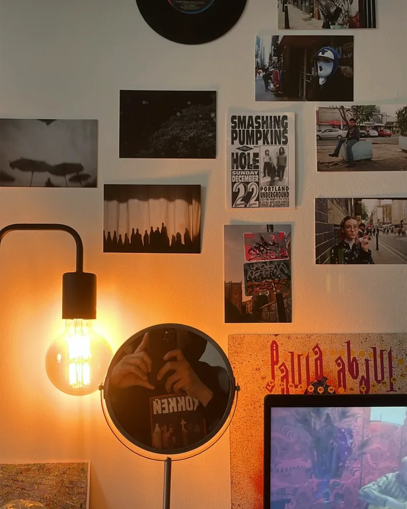 A postcard from the exhibition framed on someone’s wall